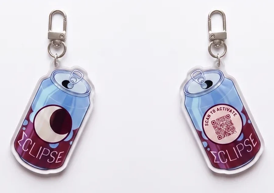 Front and reverse of the ΣCLIPSE can charm — the back carries a scan-to-activate QR code